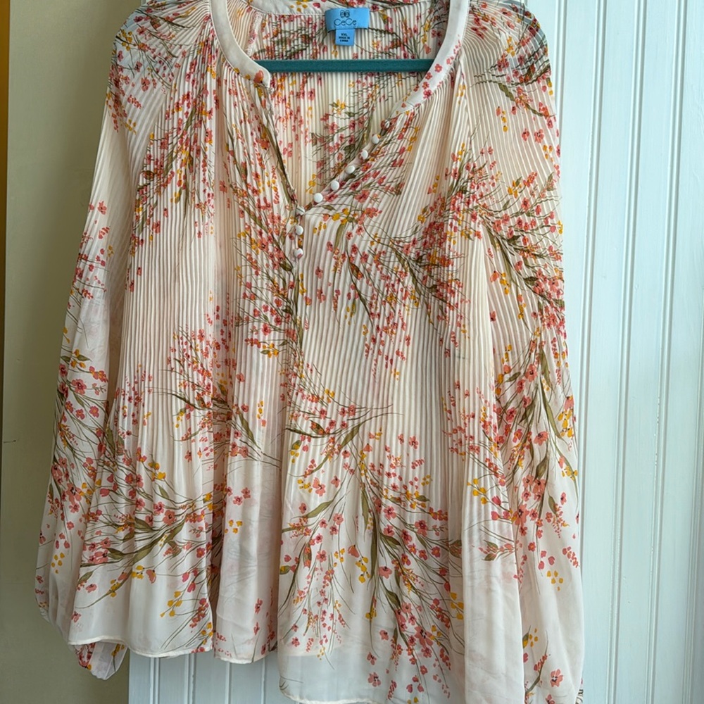 CeCe chiffon xxl shirt but fits smaller sizes too. Beautiful chiffon